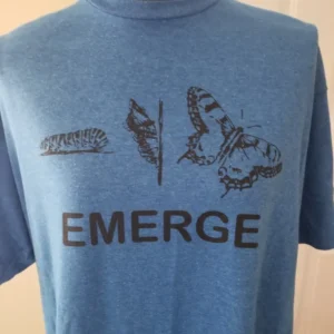 A blue shirt with the word emerge written on it.