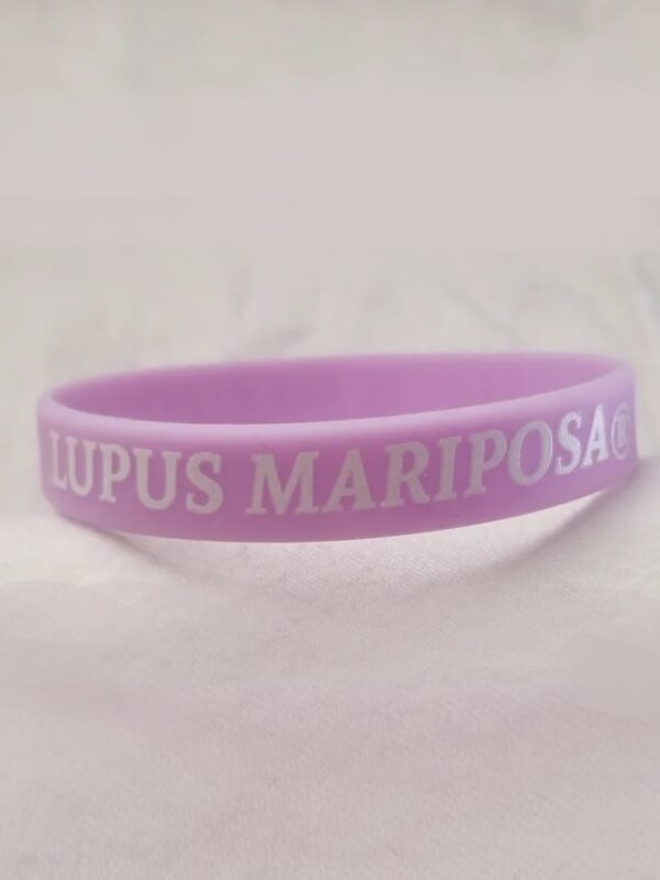 A purple wristband with lupus mariposa on it.