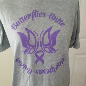 A t-shirt with the words butterflies unite and an awareness ribbon.