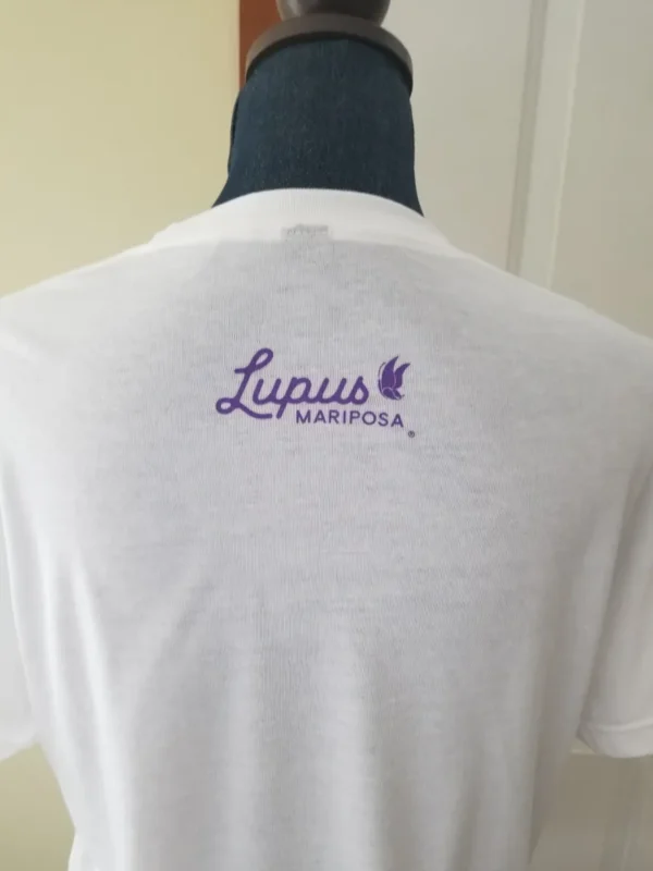 A white shirt with lupus mariposa written on it.