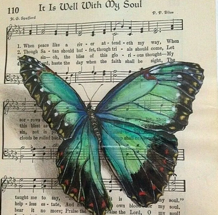 Blue butterfly on sheet music.