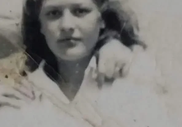 Black and white photo of a young woman.